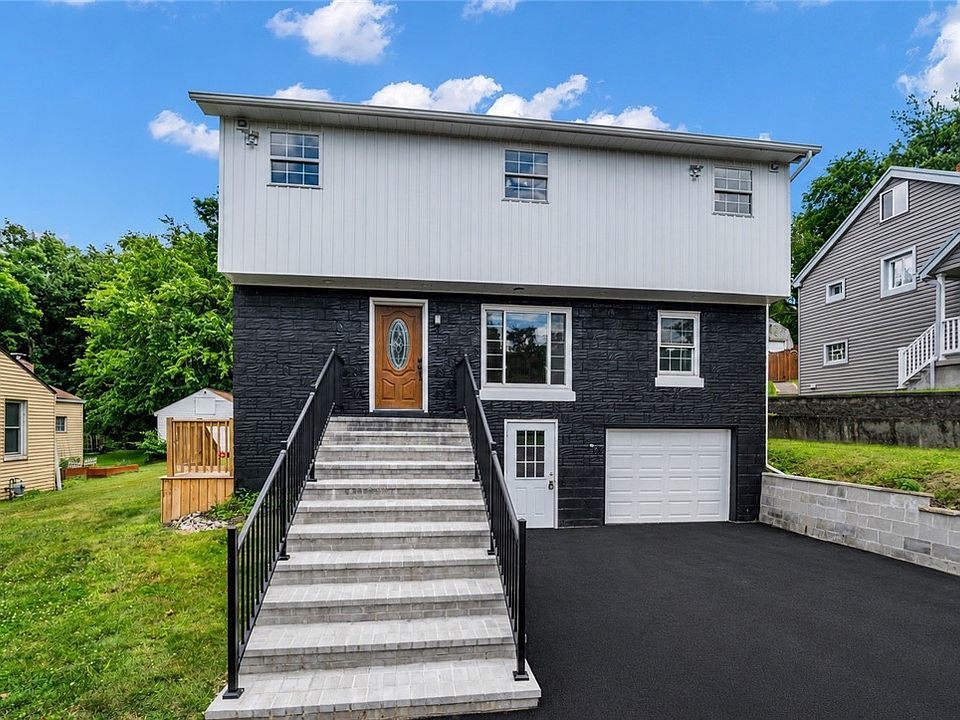 1113 Grandview Ave — two-story renovation with black stone facade