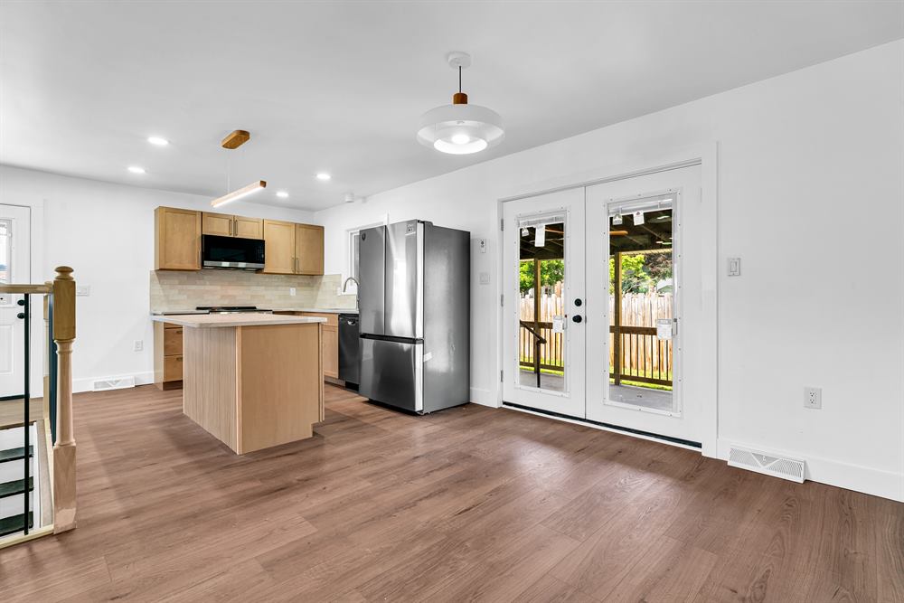 New kitchen with island and french doors at 323 Olivia Dr